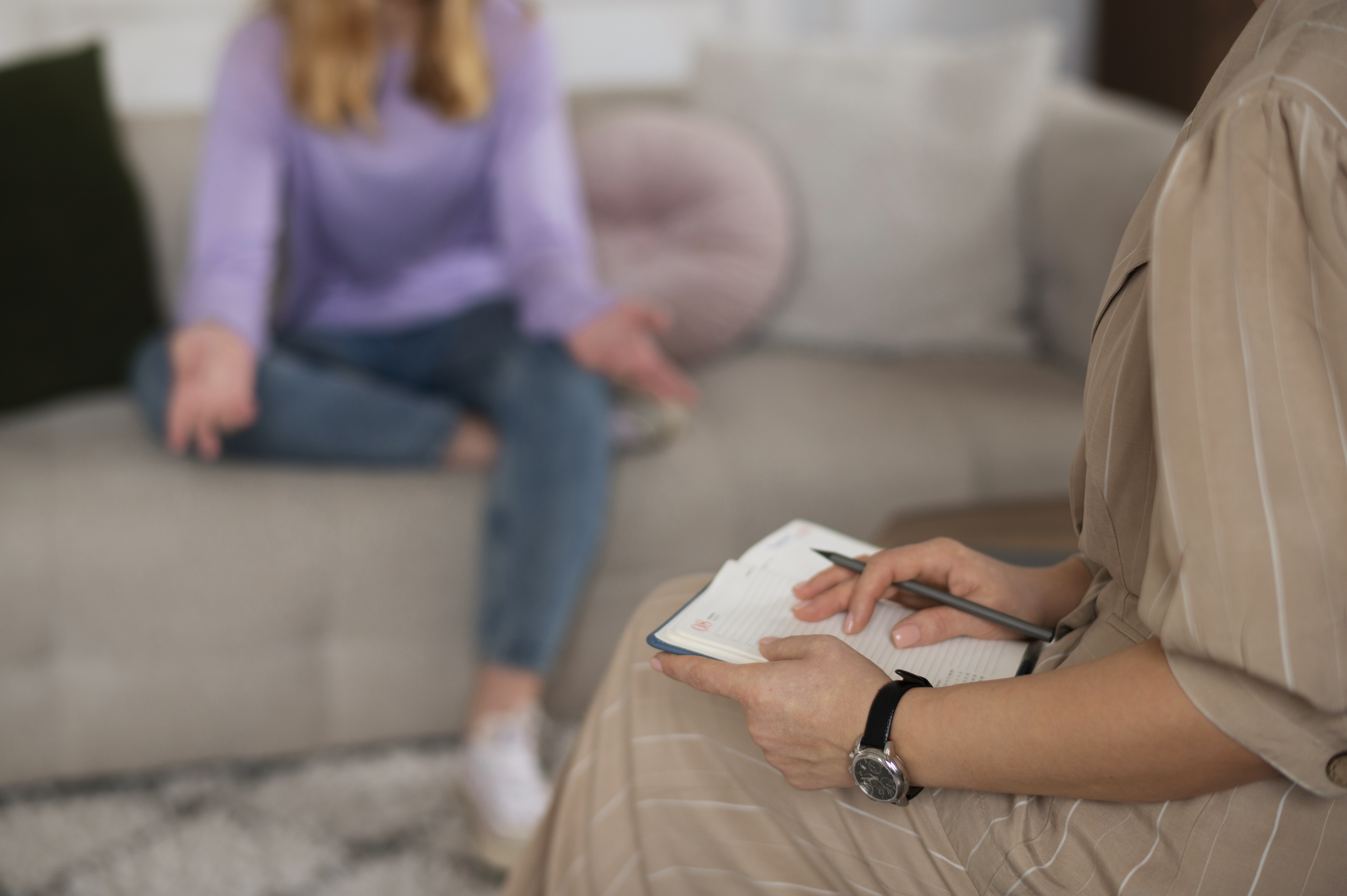 side view young girl talking therapist
